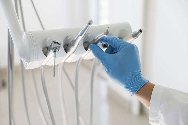 Professional Tooth Extraction technician working in West Slope, OR